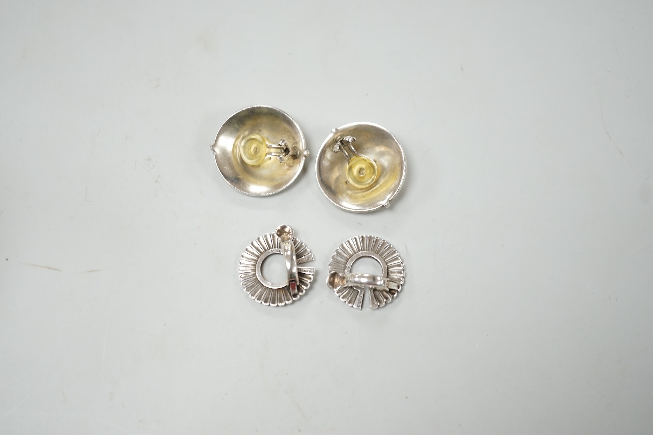 Two pairs of Georg Jensen sterling ear clips, design no. 232, 24mm and no. 92, with one Jensen box.